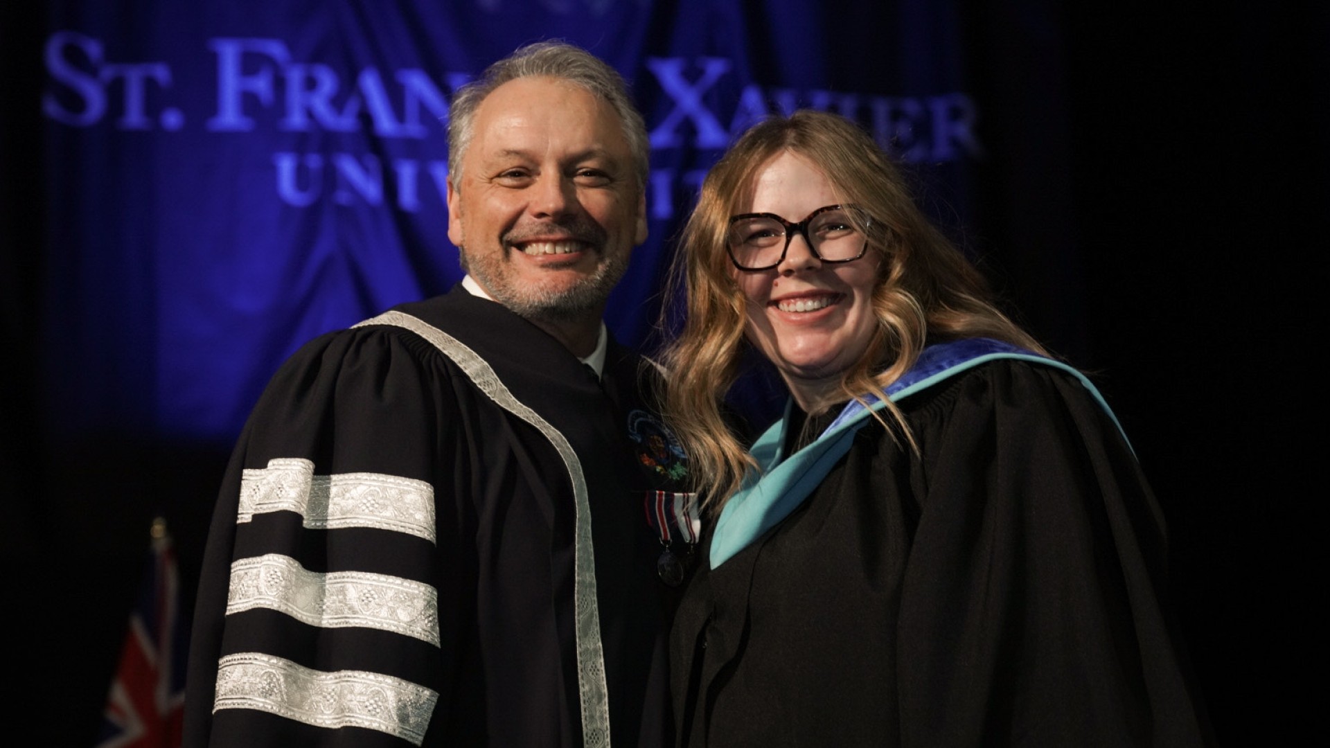 President and Vice-Chancellor, Dr. Andy Hakin and StFX graduate
