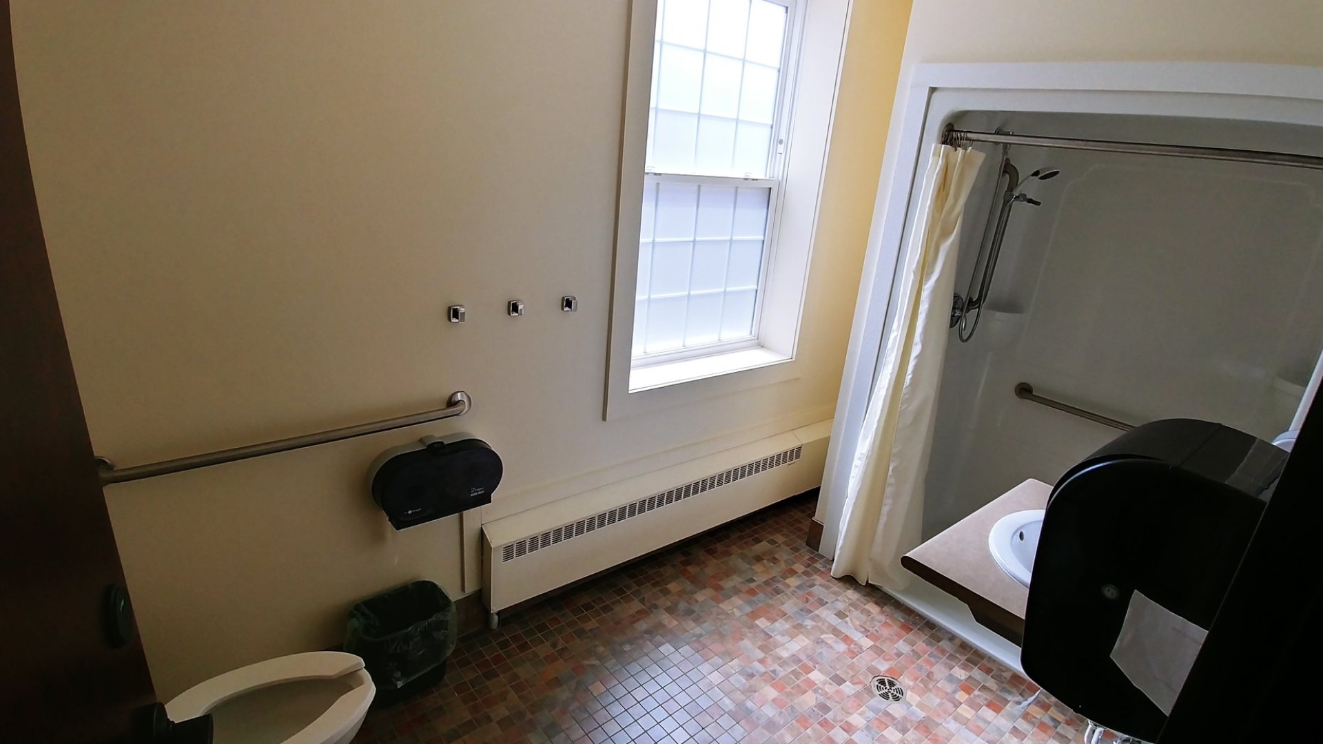 Accessible washroom with a shower, sink and toilet 