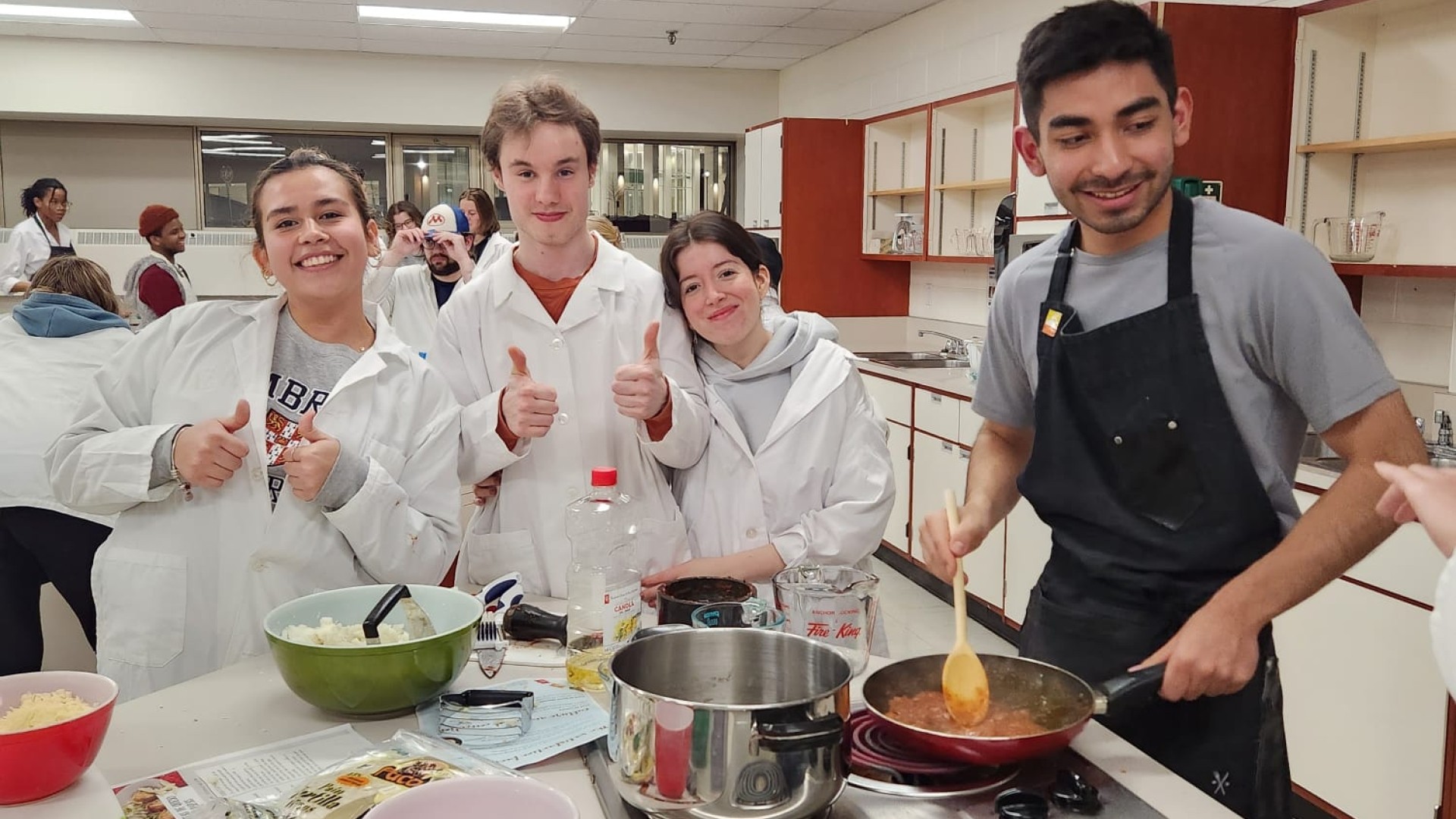 Students in the kitchen lab preparing a meal