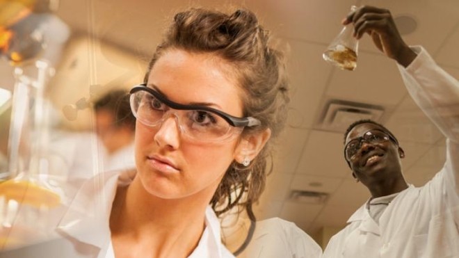 A man and a woman in lab coats and glasses