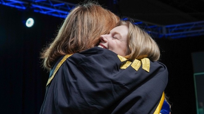 Graduating Student Hugging Mila Mulroney 