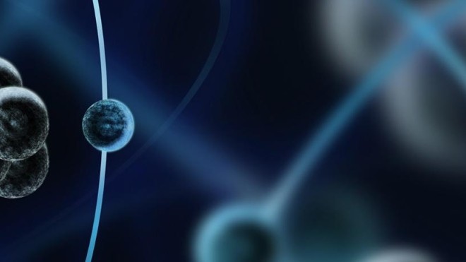 Atoms flying on a blue-black background