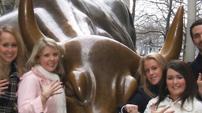 Students posing with Bronze bull statue