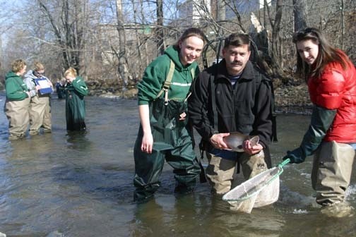 Students Holding a River Animal
