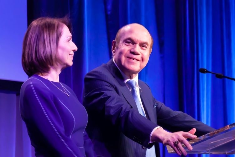 Two people at a podium