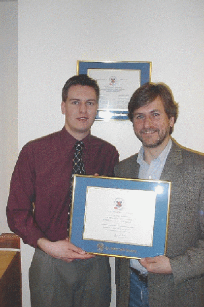 Two men showing a diploma